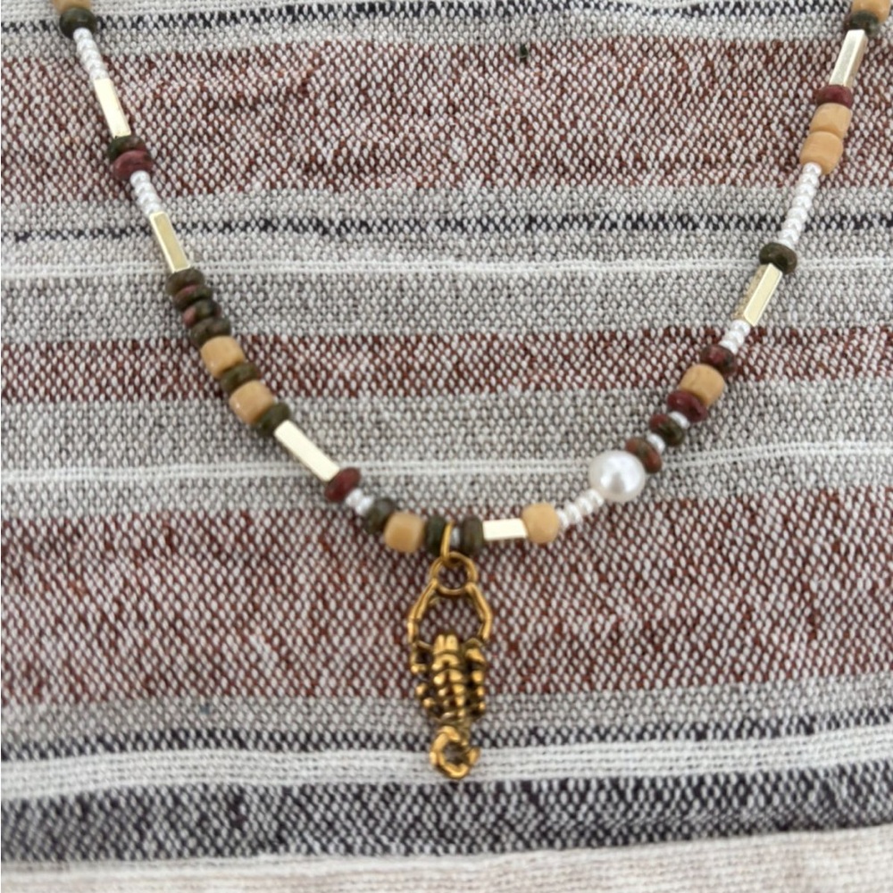 Gold and Brown Beaded Necklace with Scorpion Pendant